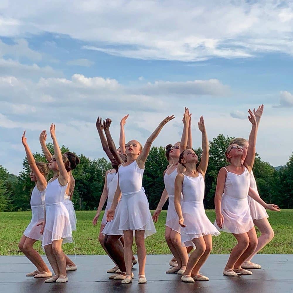 Students performing outdoors during the summer